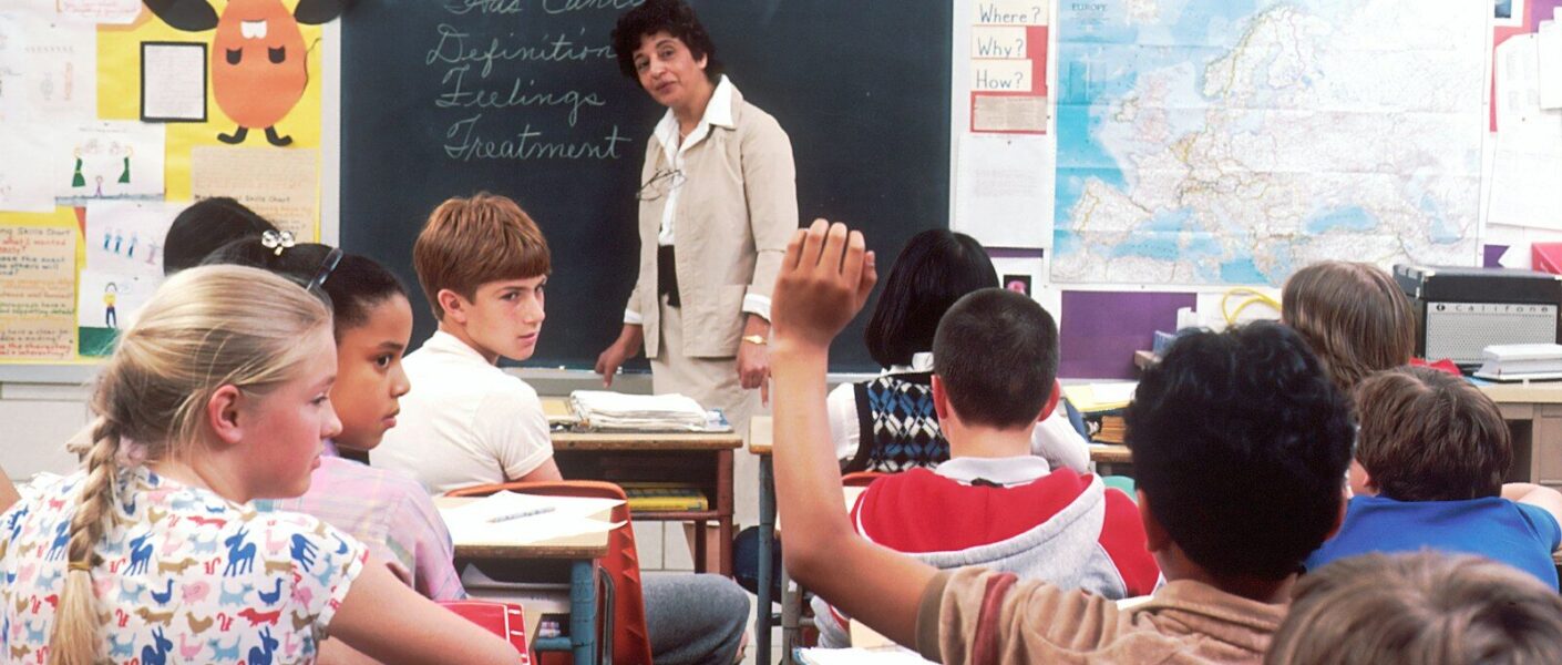 woman standing in front of children